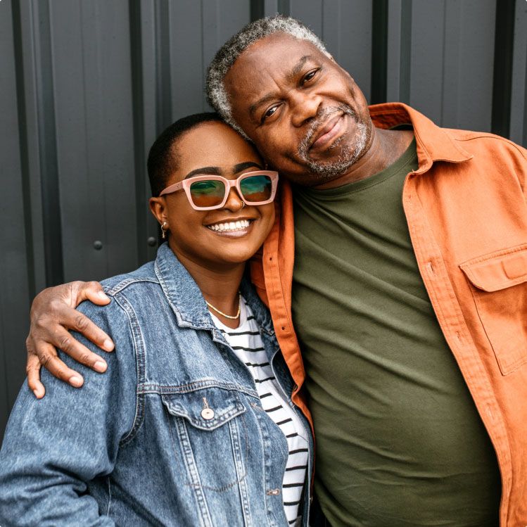 father and daughter co-buyers hugging