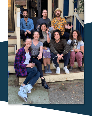 photo of a group of co-buyers sitting on the front steps of their house