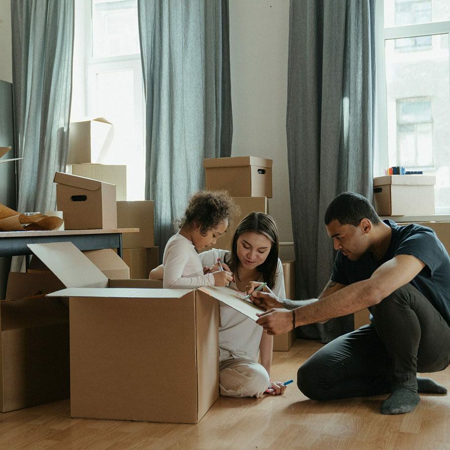 couple and their child moving into a new home